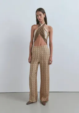 Viktoria & Woods Chauffeur Trouser In Gold Monogram for rent on The Volte - image 1