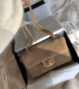 Chanel Maxi Souplissimo Flap Bag Mini Beige Suede for rent on The Volte - image 1