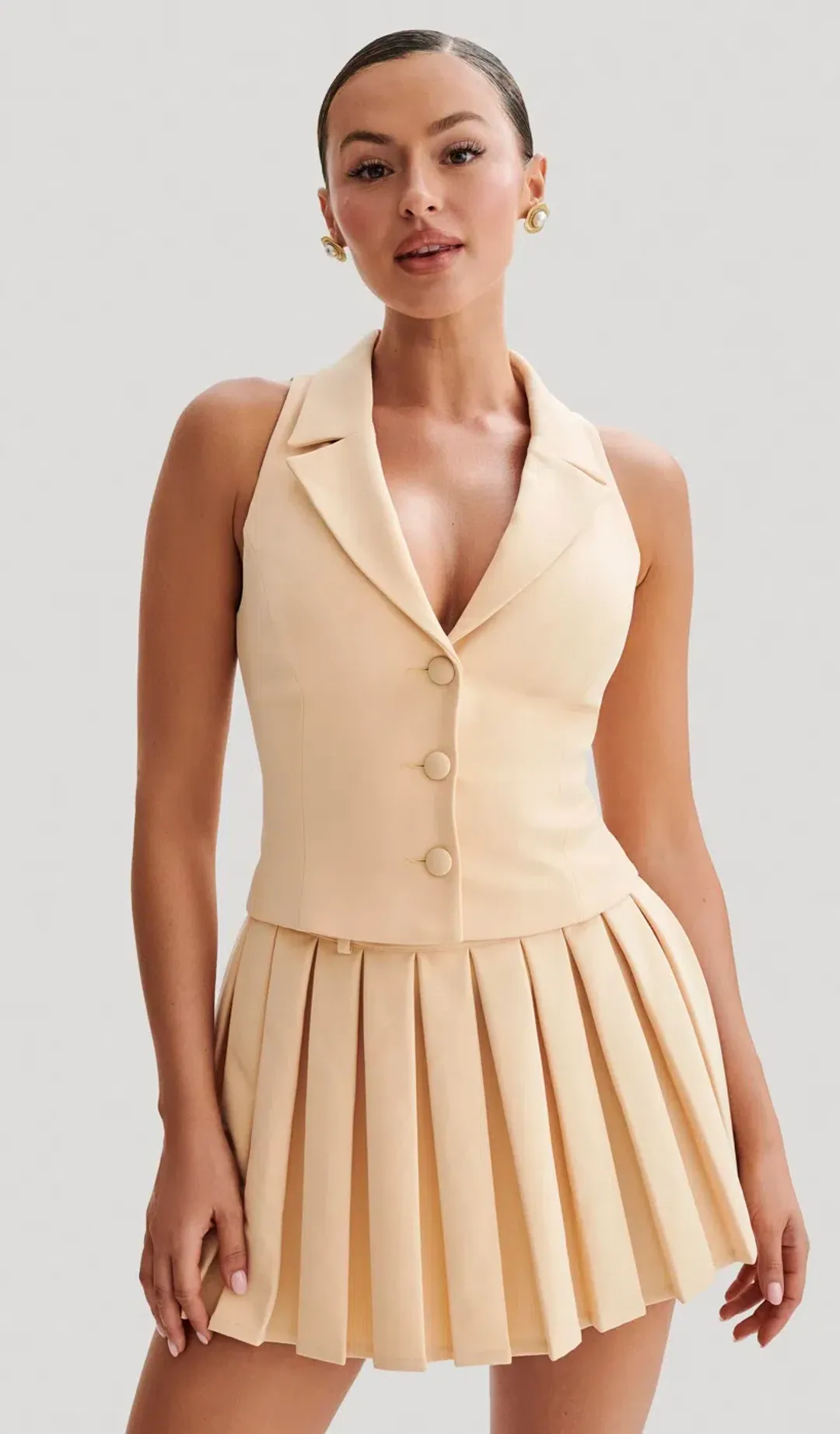 Meshki Mura Suiting Vest and Pleated Mini Skirt Set Peach Size 6 for rent on The Volte - main image