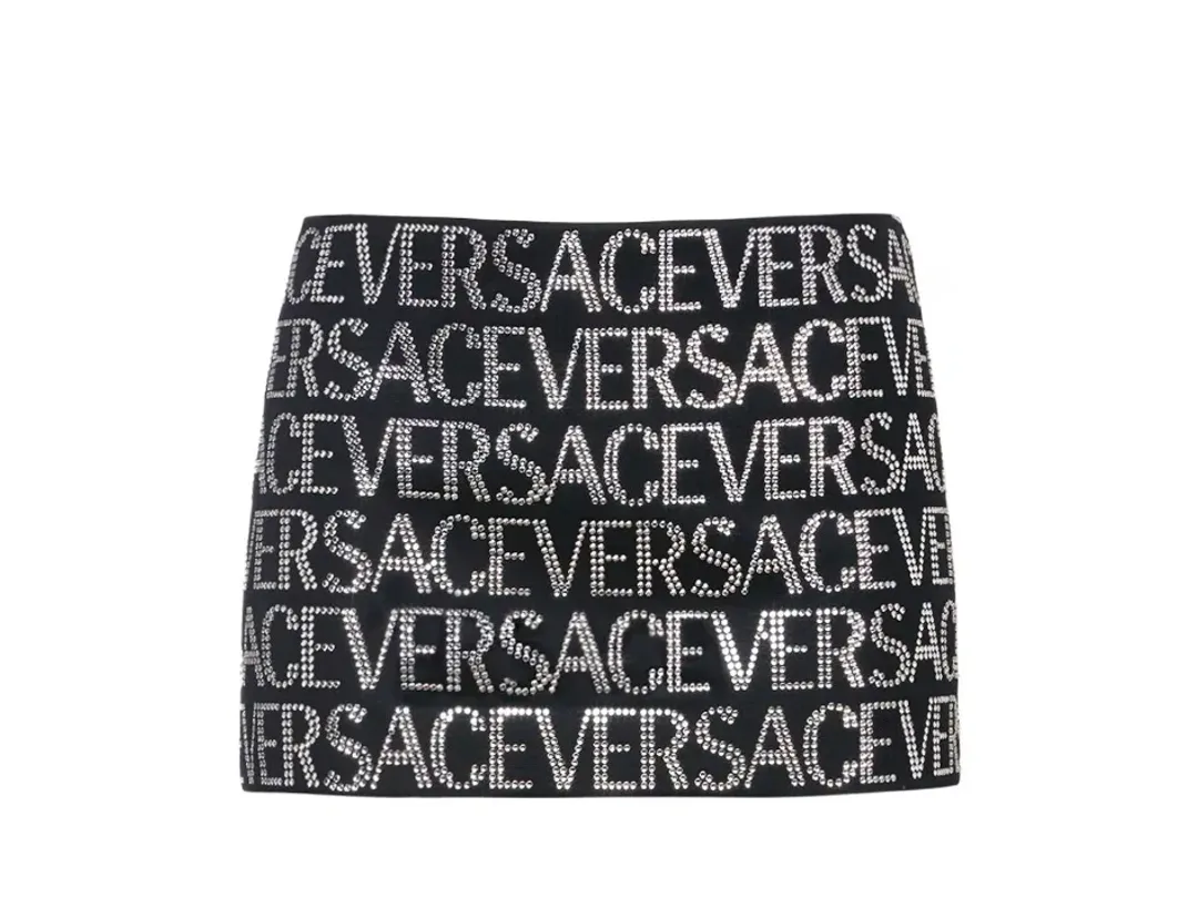 Versace Embellished Logo Wool Mini Skirt In Black/Silver Size 8  for rent on The Volte - main image
