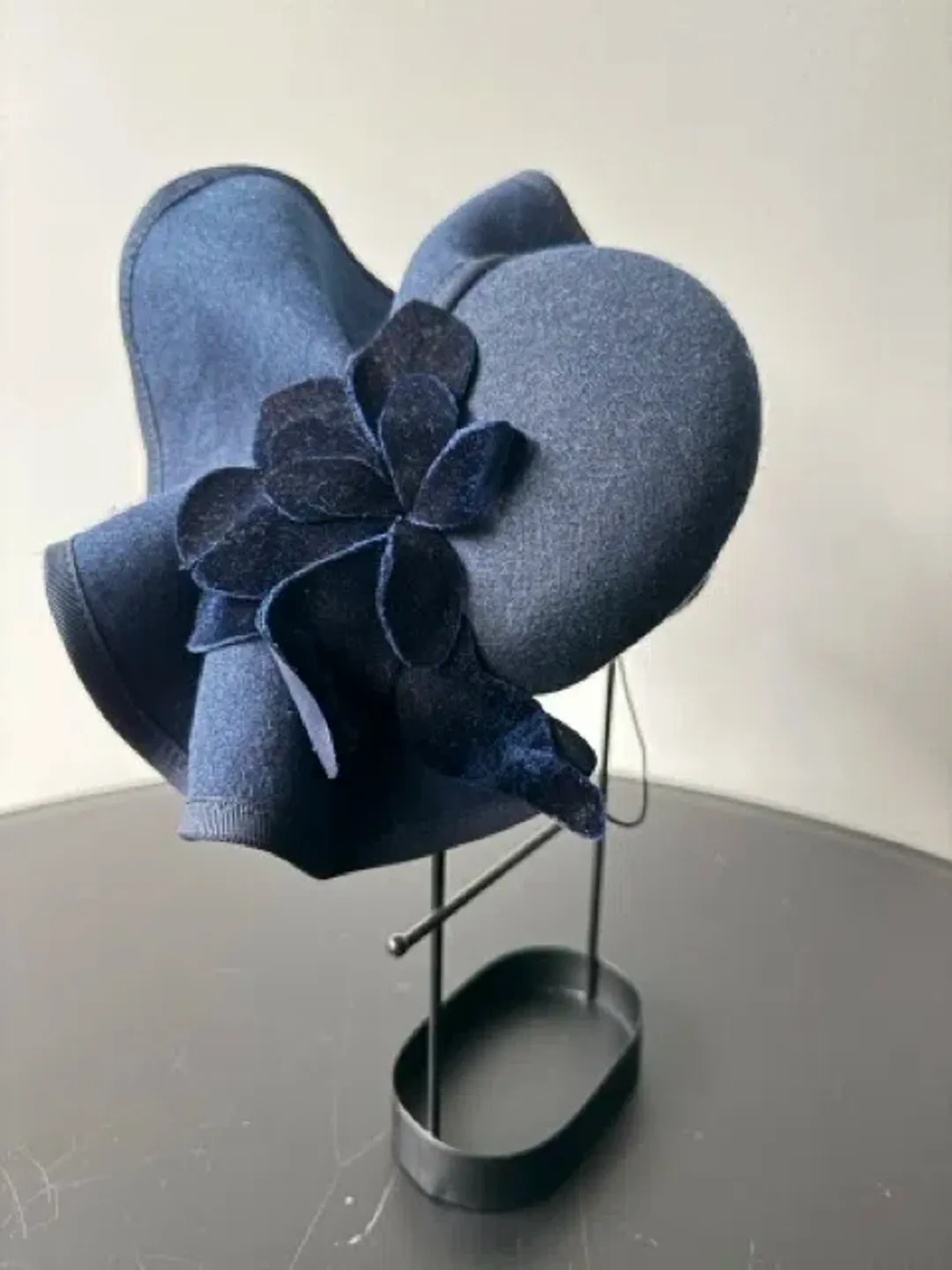 Felted Wool Headpiece with Sculptural Detail and Floral Velvet Adornment Navy One Size for rent on The Volte - main image