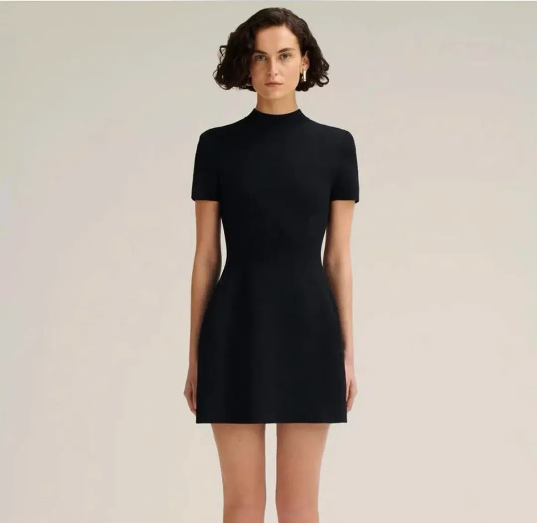 Scanlan Theodore Crepe Knit Peplum Mini Dress Black Size S / AU 8 for rent on The Volte - main image