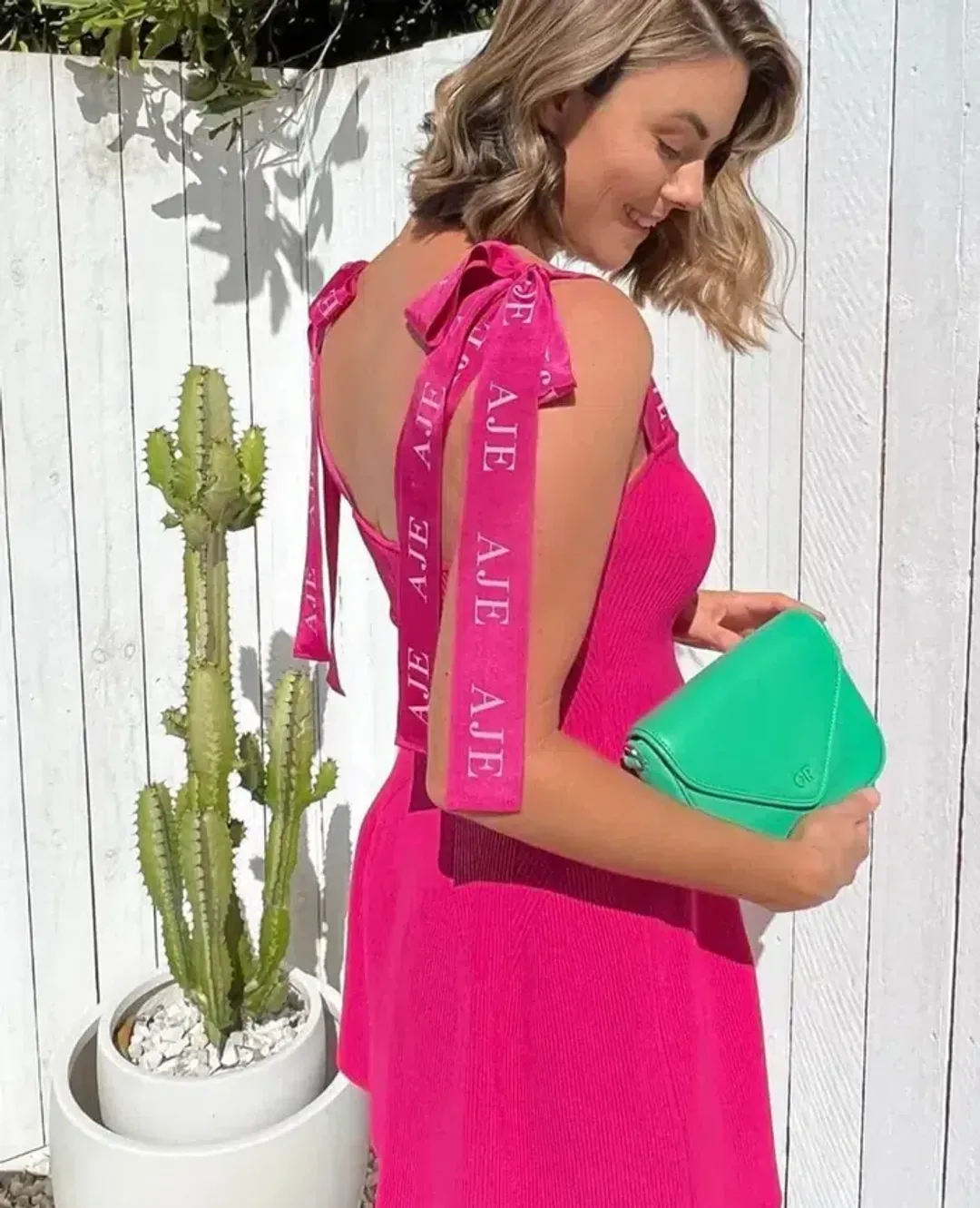 Aje Amber Knit Tie Shoulder Mini Dress Fuchsia Pink Size S AU 8 for rent on The Volte - main image