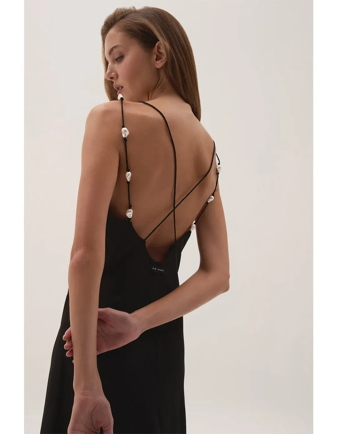 Aje Studio Agate cross back black dress 10 for rent on The Volte - main image