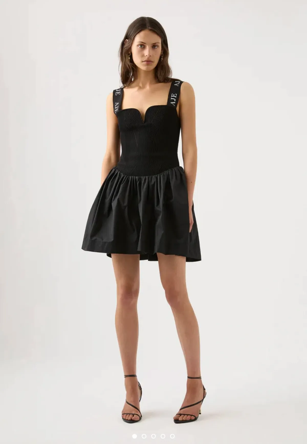 Aje Mira Logo Strap Tulip Mini Dress Black Size XL / Au 14 for rent on The Volte - main image