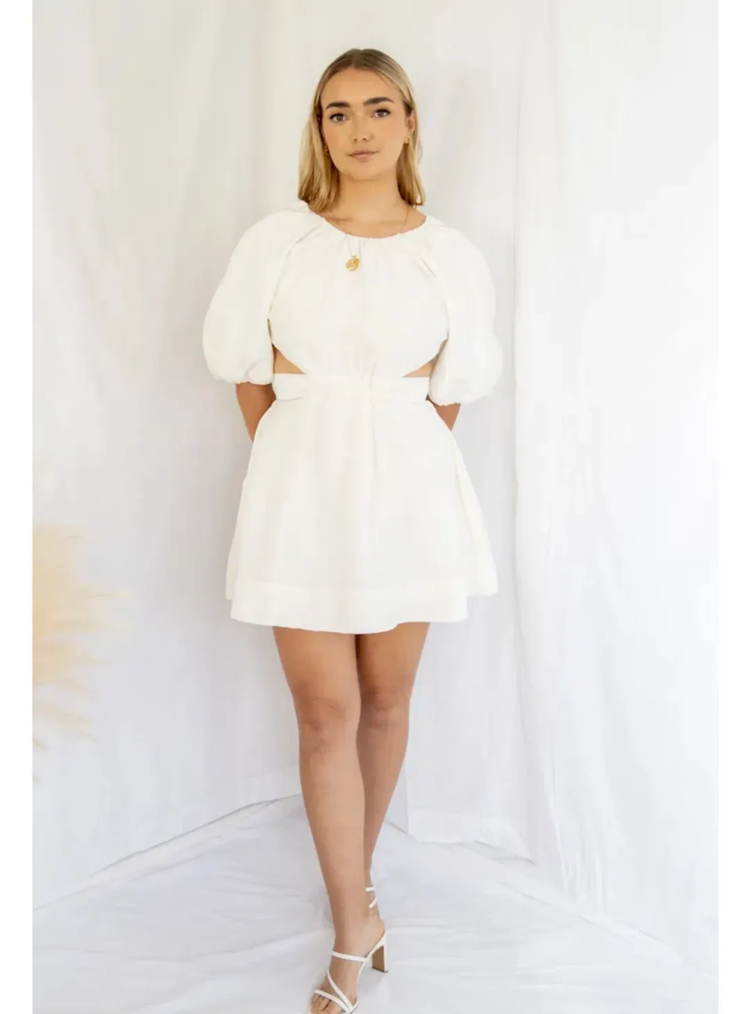 Aje Mimosa Cut Out Mini Dress in Ivory Size AU 6 for rent on The Volte - main image