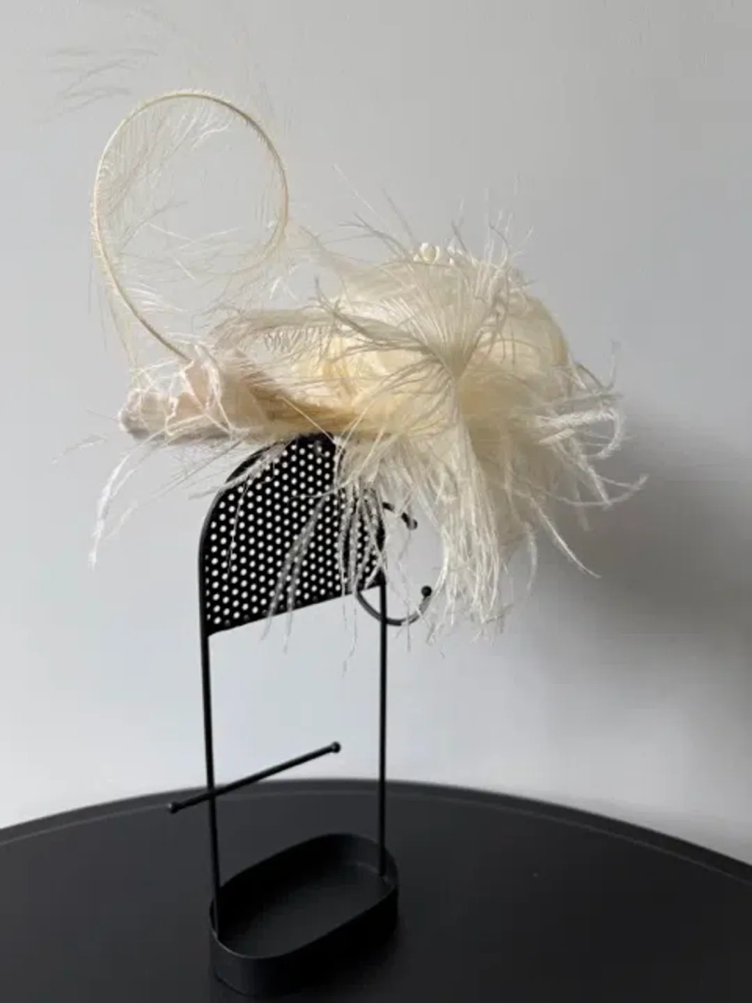 Morgan and Taylor Delicate Feather Fascinator Cream for rent on The Volte - main image