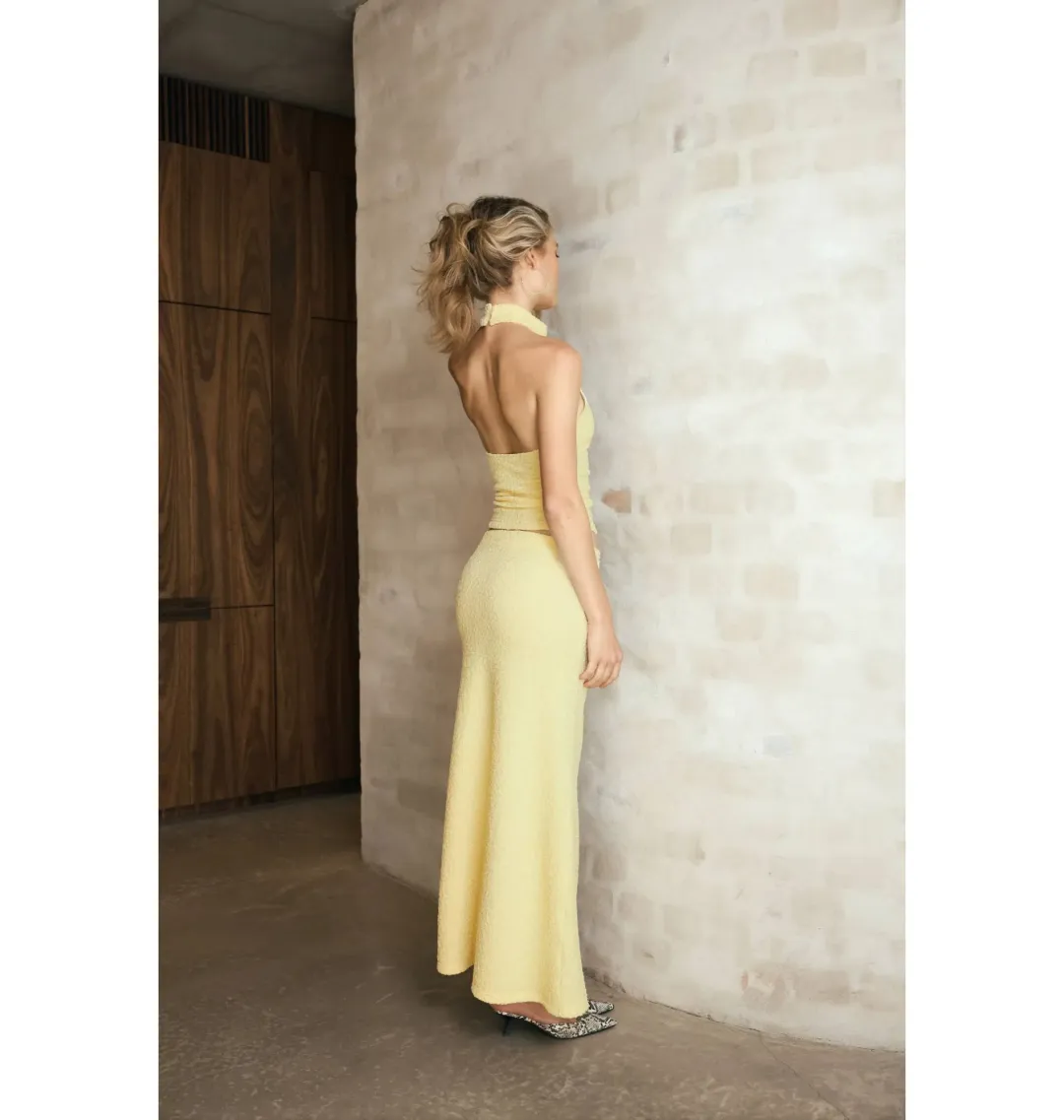 With Harper Lu Textured Halter Top and Maxi Skirt in Limoncello Set Size M / AU 10 for rent on The Volte - main image