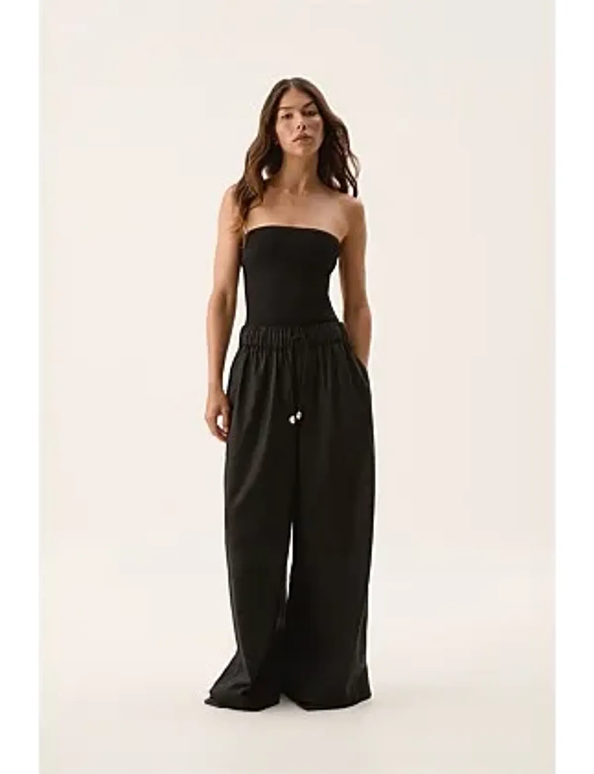Aje Airlie Relaxed Pants in Black Size AU 8 for rent on The Volte - main image