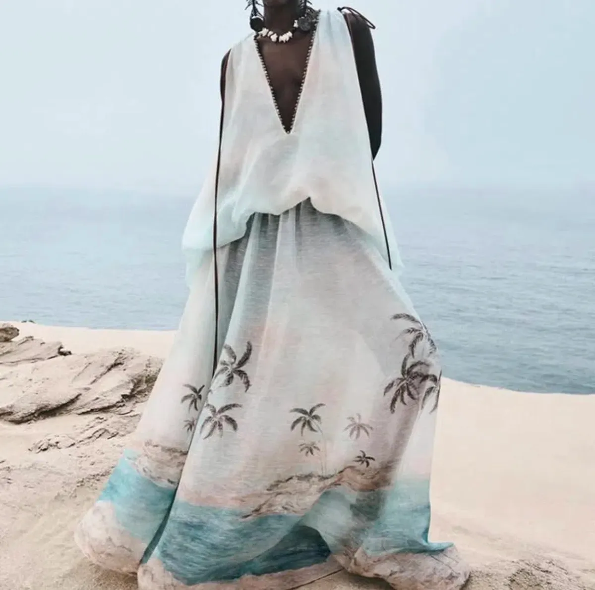Zimmermann Illuminate plunge gown features a scenic palm tree print and beaded neckline details for rent on The Volte - main image