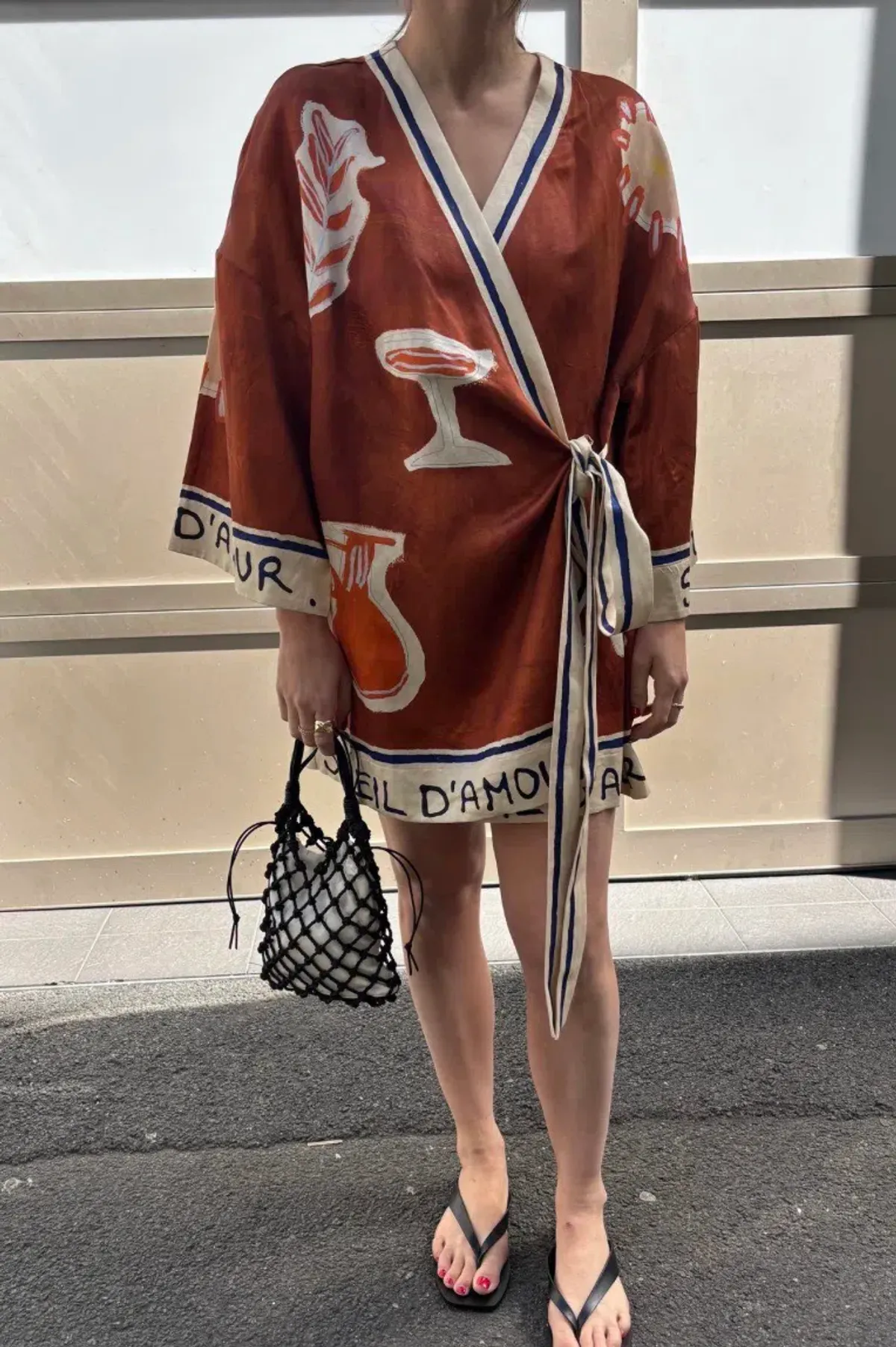 ALEMAIS Soleil D'Amour Printed Wrap Mini Dress Rust Size 8 AU for rent on The Volte - main image