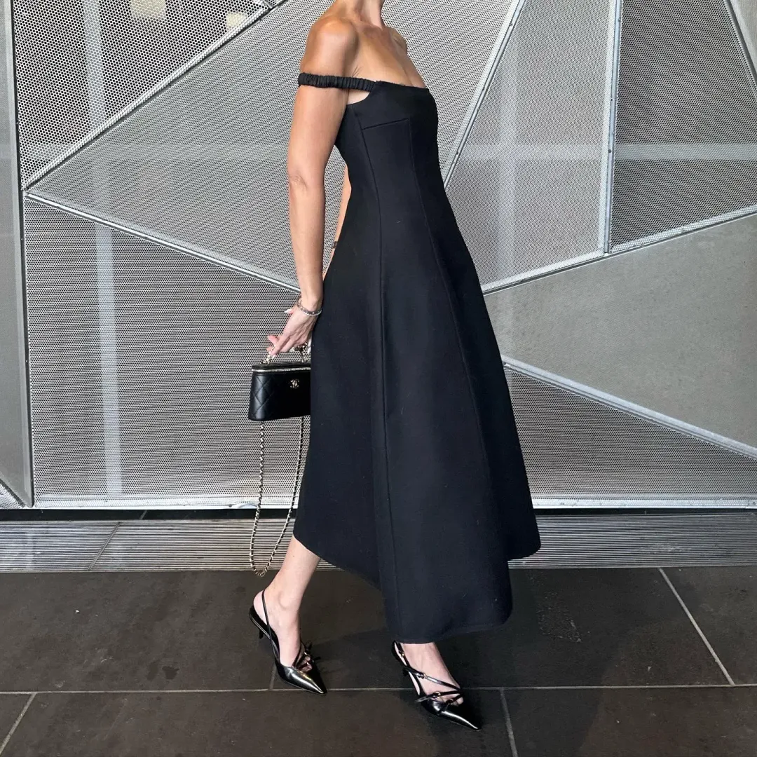Khaite NY black midi dress for rent on The Volte - main image