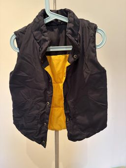 Girls Black Puffer Vest with Yellow Lining, Size 4 for rent on The Volte - image 1